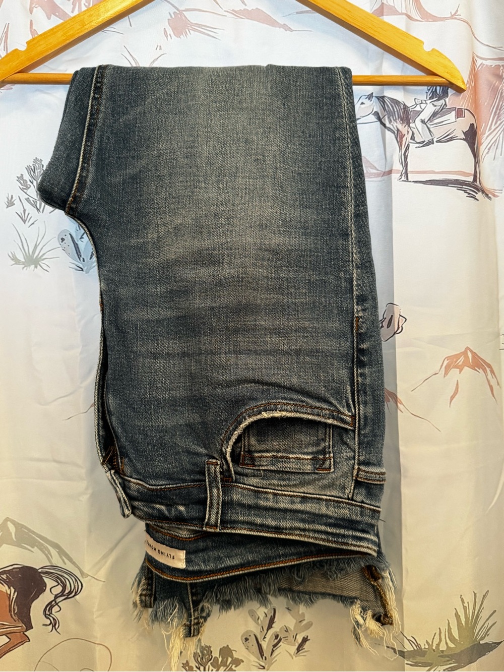 Flying Monkey Woman’s Straight Jean in Washed Denim.